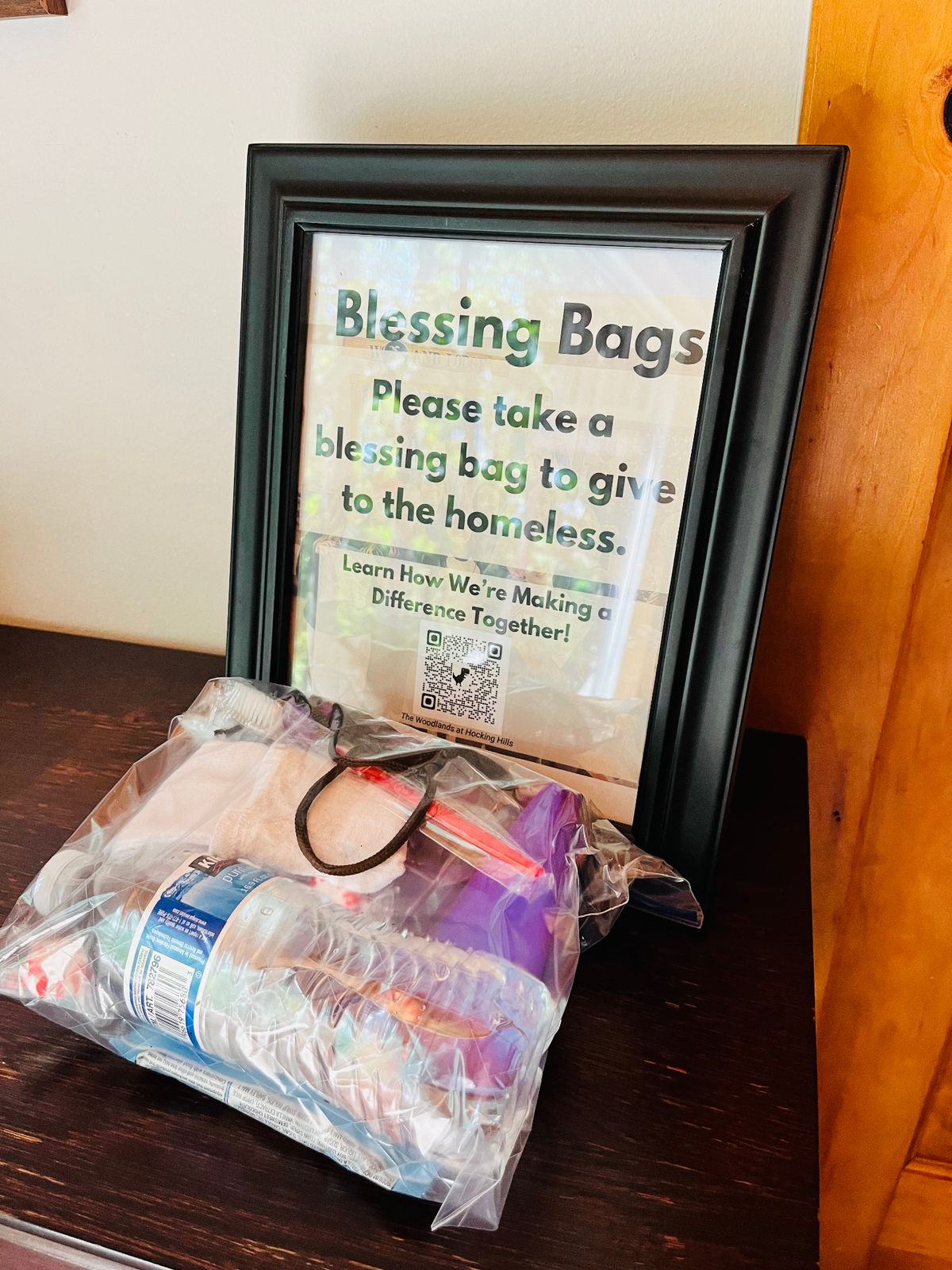 A Blessing Bags display inviting guests to take a bag to give to the homeless
