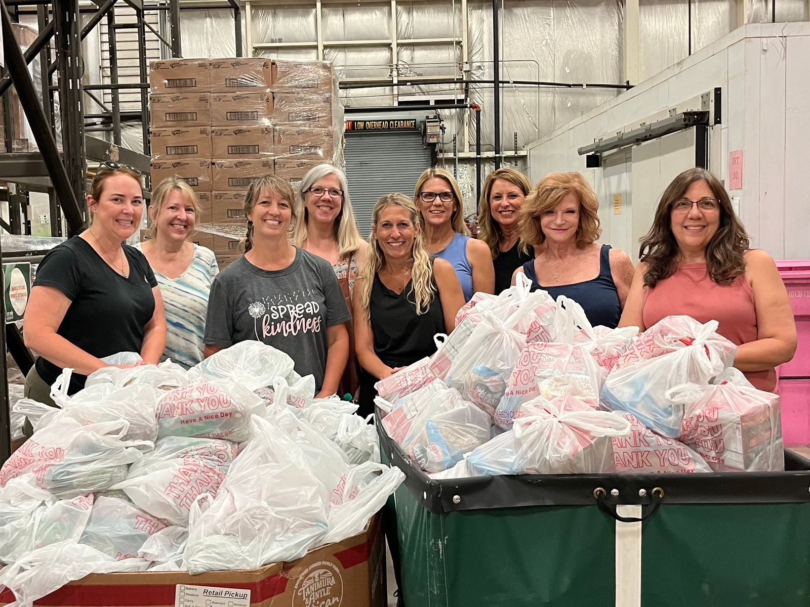 A team of hosts assembling blessing bags for those in need