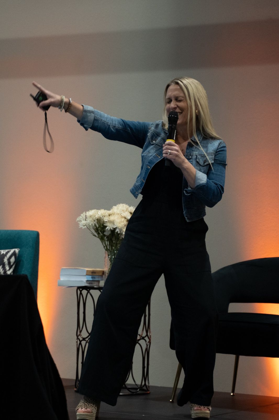 Debbie speaking on stage at a Give Back Hospitality event