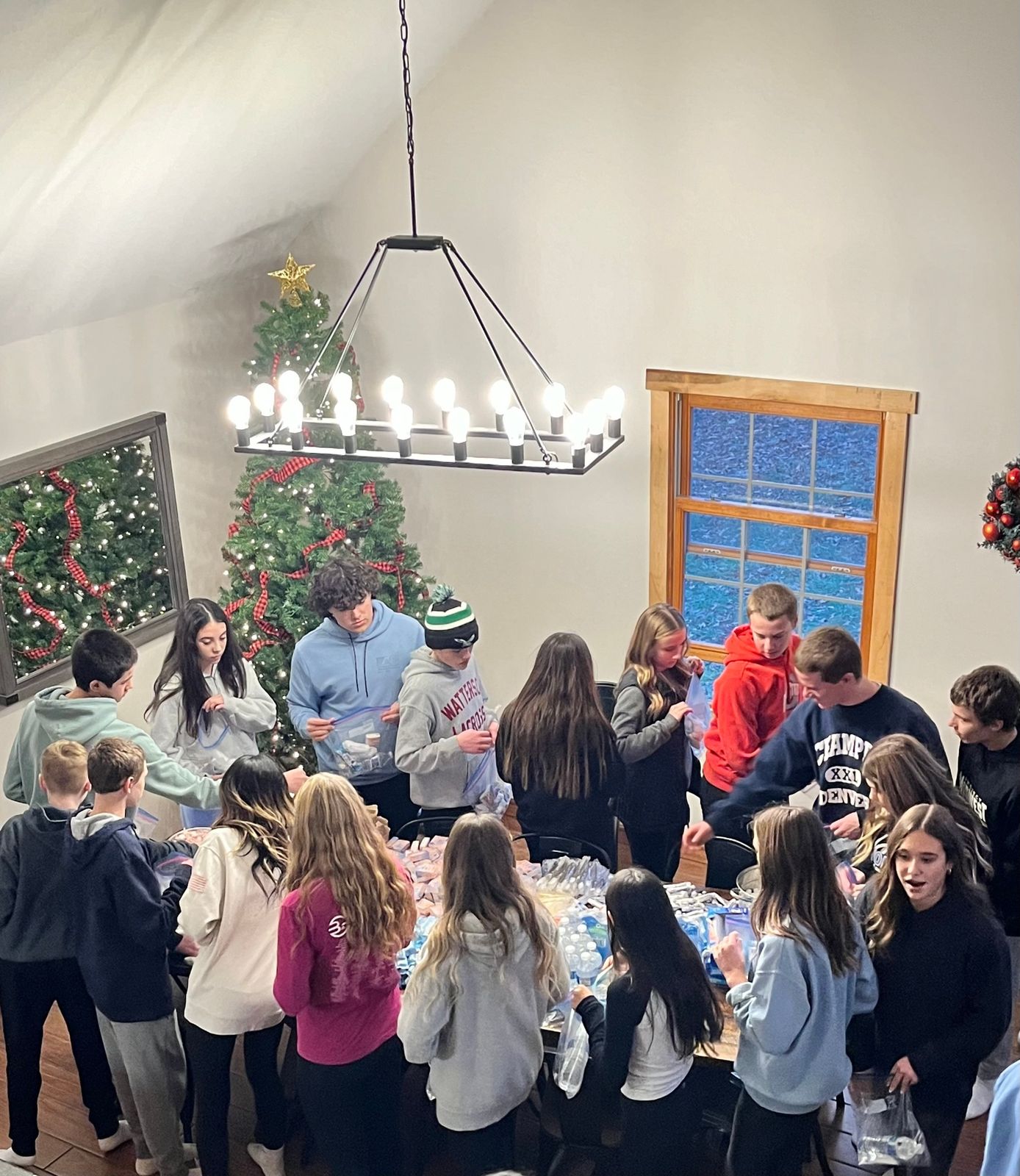 Guests gathering to assemble blessing bags