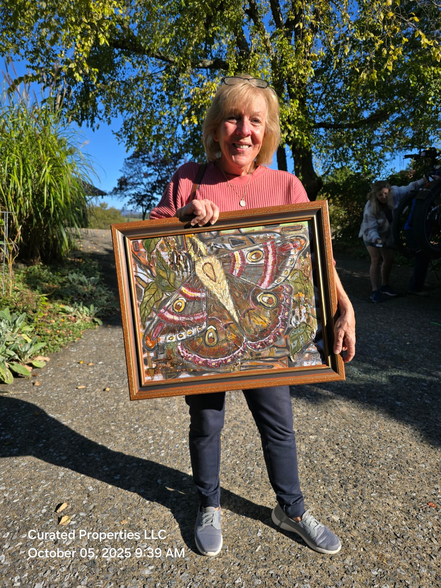 Curated Properties LLC community art project featuring framed local artwork